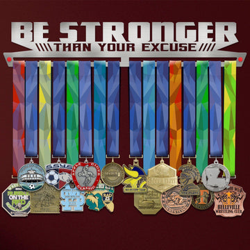 Be Stronger Than Your Excuse Medal Hanger Display holding colorful ribbons and various sports medals, ideal for organizing achievements.