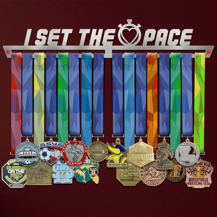 I Set The Pace Medal Hanger Display showcasing multiple colorful ribbons and medals, ideal for organizing and displaying athletic achievements.