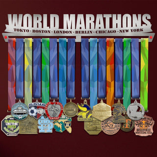 World Marathons Majors Medal Hanger Display Rack V2 holding colorful marathon medals from Tokyo, Boston, London, Berlin, Chicago, and New York.